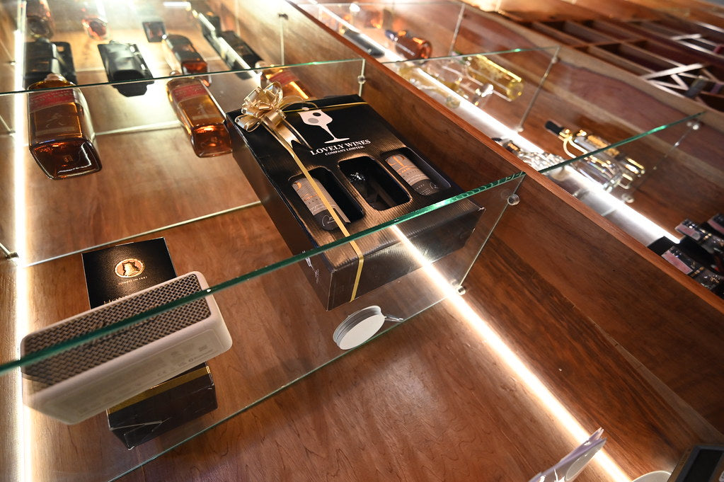 A selection of best eau de parfum 2026 bottles on a minimalist shelf, showcasing expert-picked scents for lasting value.