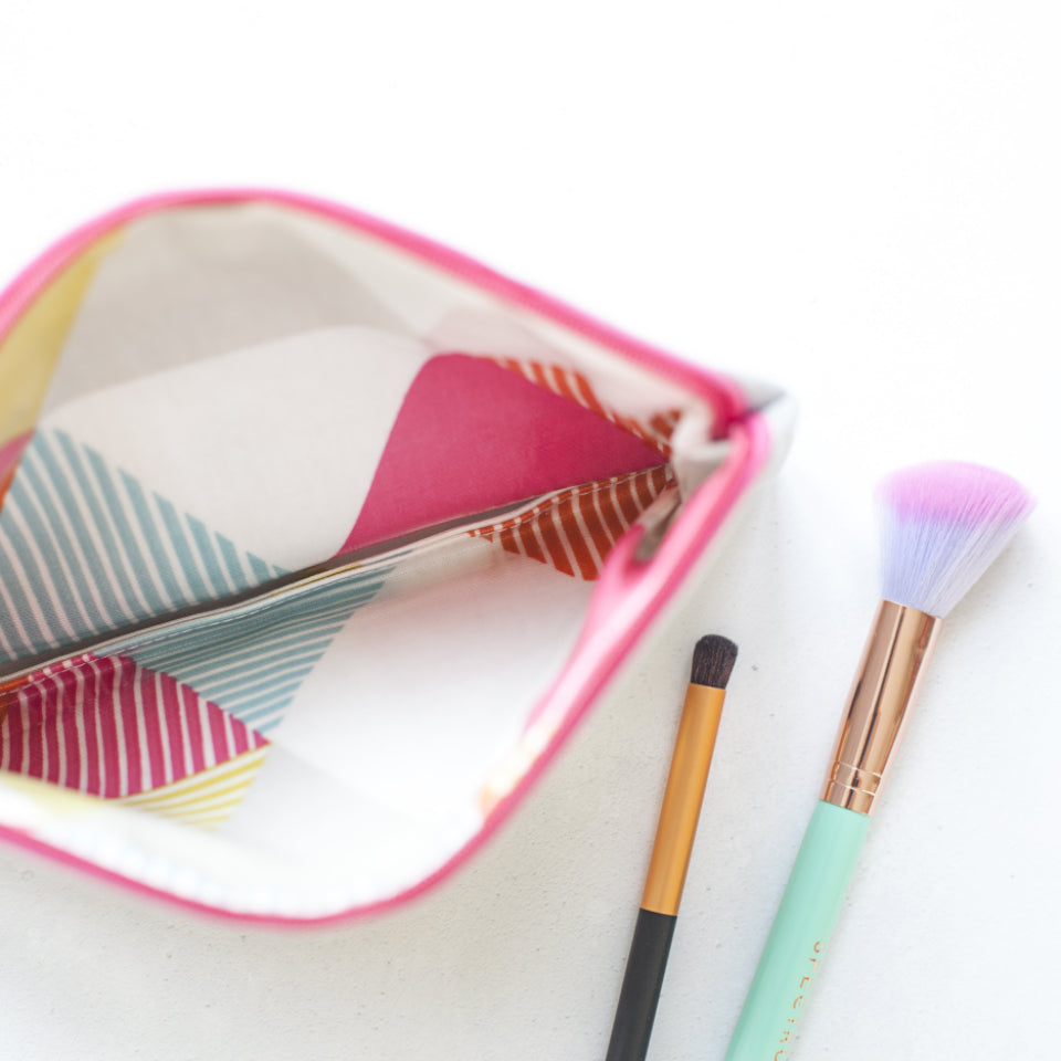 A selection of best hair brushes 2026 arranged on a light surface, including paddle, round, and detangling brushes.