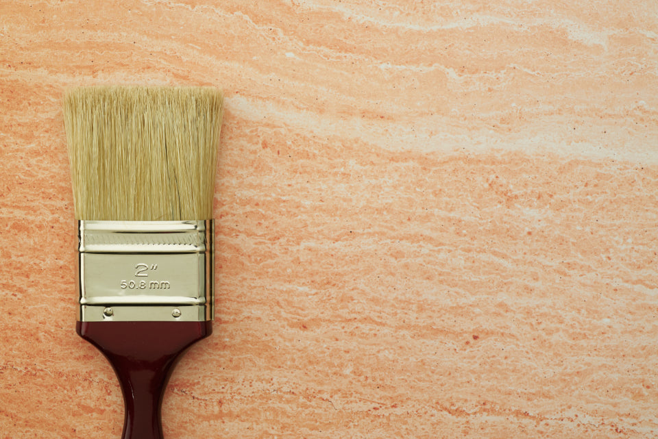 A selection of the best hair brushes 2026, including paddle, round, and detangling styles, laid out on a clean surface.