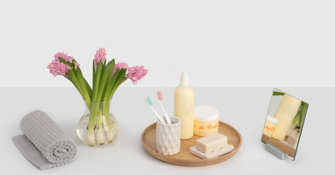A collection of balms and moisturisers arranged on a bathroom shelf, illustrating a balms & moisturisers buying guide selection.
