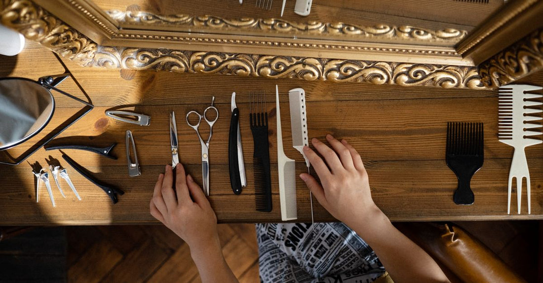 Selection of the best clipper combs and guides for 2026 arranged on a bathroom shelf, showing various sizes and colours.