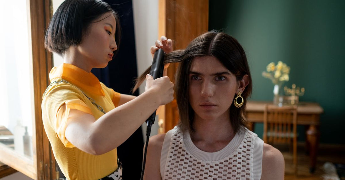 A sleek hair straightener with ceramic plates resting on a marble surface, illustrating how to choose straighteners UK for budget-conscious shoppers.