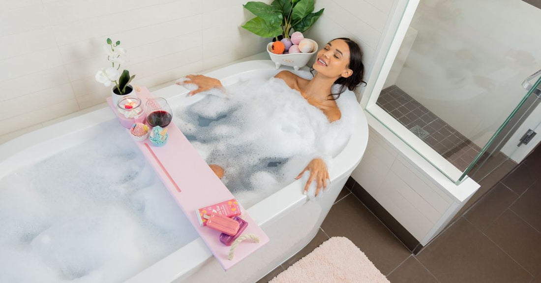 Colourful bubble bath bottles lined up on a bathroom shelf, representing the best bubble bath for kids UK.