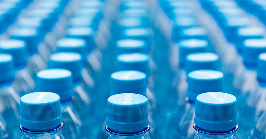 A row of different conditioner bottles on a shelf, illustrating the variety covered in our conditioners buying guide.