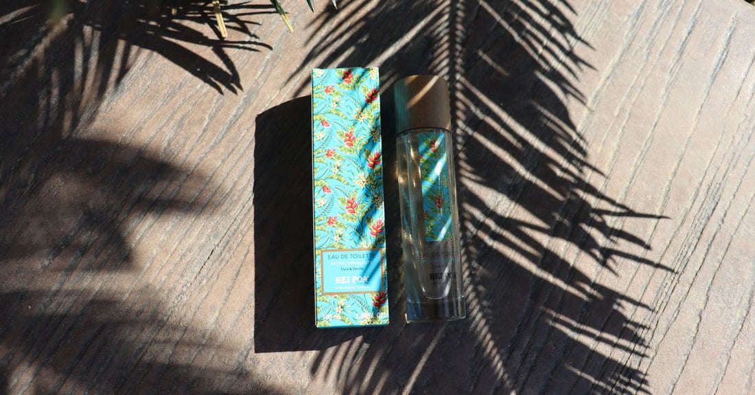 A collection of cologne bottles on a sunlit outdoor table, representing the best cologne 2026 for summer lasting power.
