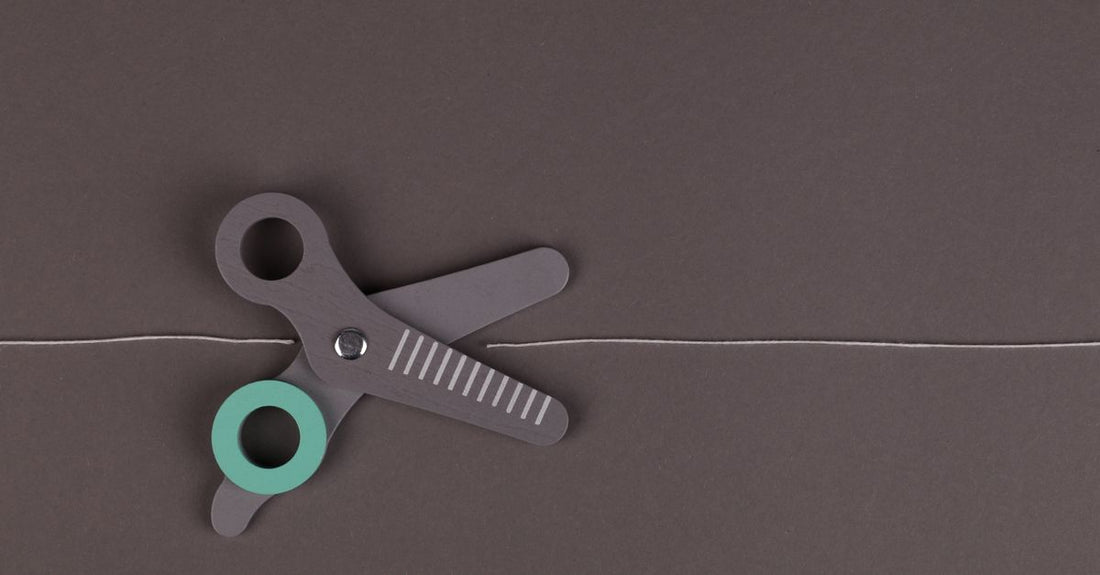 Professional hair cutting shears displayed on a white surface, illustrating how to choose shears UK for precise grooming.
