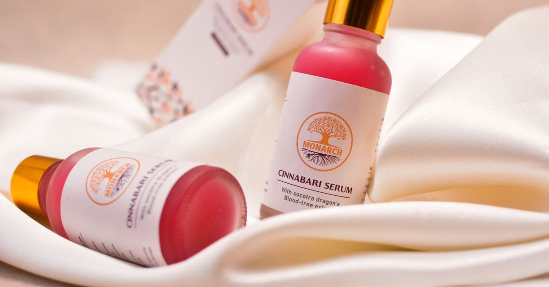 A clear glass retinol serum bottle with a dropper on a marble surface, representing retinol for beginners skincare products.