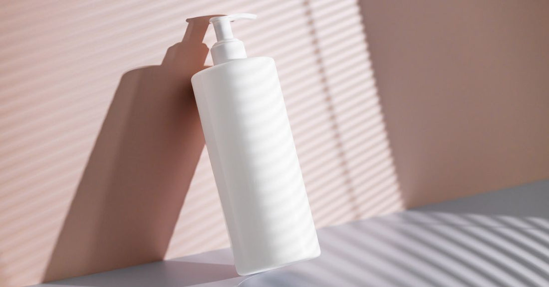 A flatlay of body self-tanner products including mousse, mist, and lotion bottles on a neutral background, representing a body self-tanners buying guide.