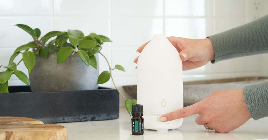 White ultrasonic essential oil diffuser emitting a fine mist on a clean background, illustrating the diffusers buying guide UK