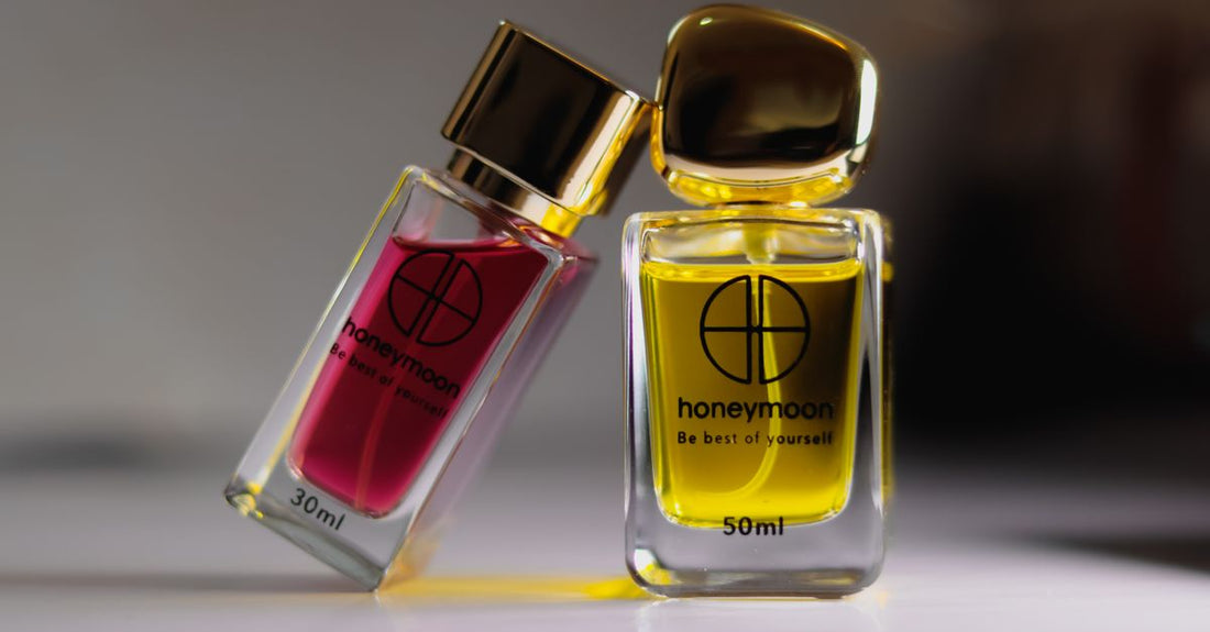 A row of cologne bottles on a marble surface, demonstrating how to choose cologne by scent families.