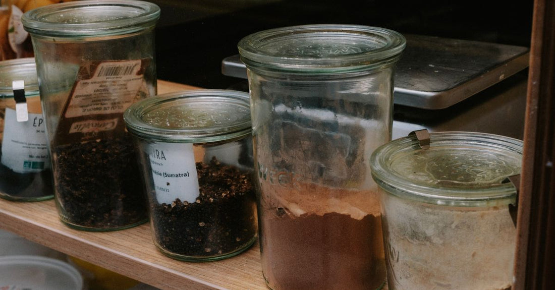 Assorted pomade jars on a shelf representing a pomades buying guide UK