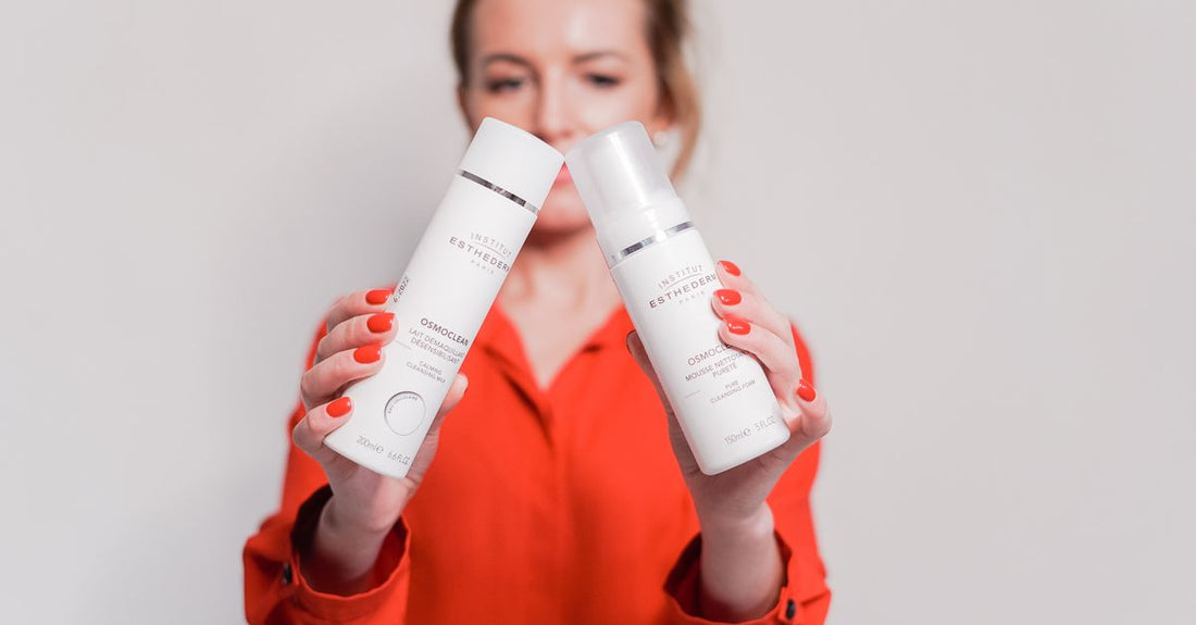 A row of self tanner bottles for body, including mousse and bronzing drops, on a light shelf — best self tanner for body UK