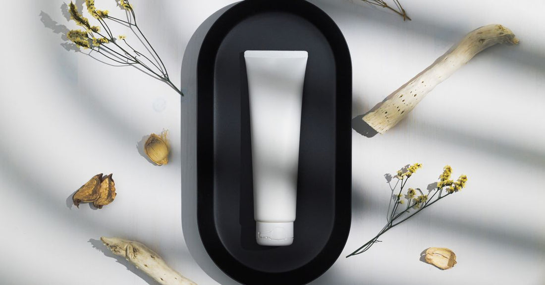 A row of BB cream tubes on a marble surface, illustrating how to choose the right one for long-term skin benefits.