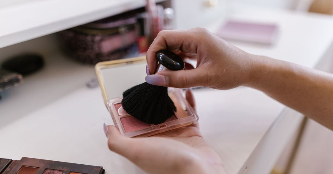 Three soft pink and peach blush compacts arranged on a white marble surface, representing the best blush for fair skin UK options.