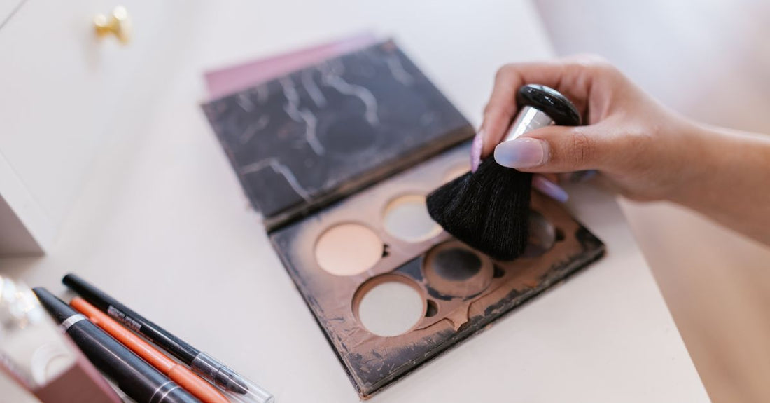 A silicone makeup brush cleaning mat with textured surfaces and a drying rack holding several brushes, showcasing the best brush cleaners 2026 for UK shoppers.