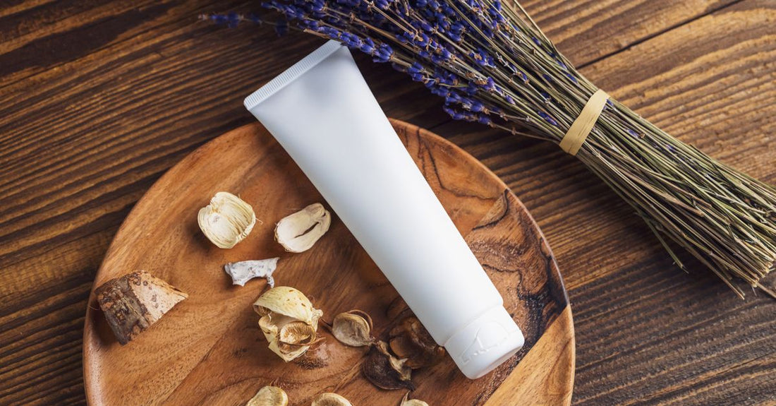 Two BB cream tubes lying on a white marble surface, illustrating a BB creams buying guide for choosing the right formula.