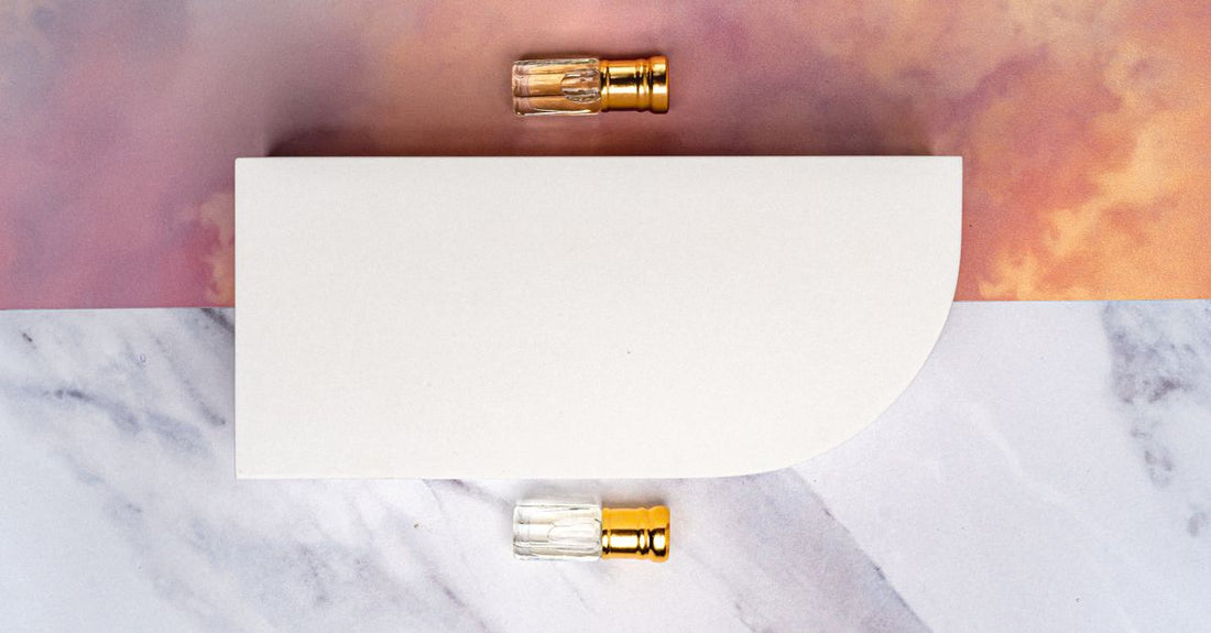 Elegant perfume bottles displayed on a marble surface, representing the best perfume for women UK in 2026.