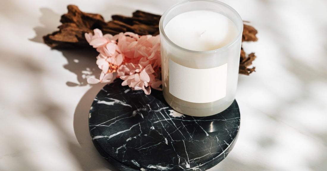 A selection of balms and moisturisers on a marble surface, illustrating how to choose the right formula for your skin type in the UK.