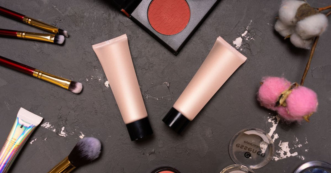 A flatlay of the best sets & kits UK 2026 featuring skincare and body care products arranged on a marble surface.