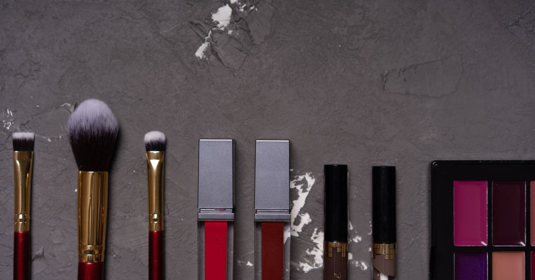 A flatlay of various eyeshadow brushes on a marble surface, illustrating an eyeshadow brushes buying guide UK.