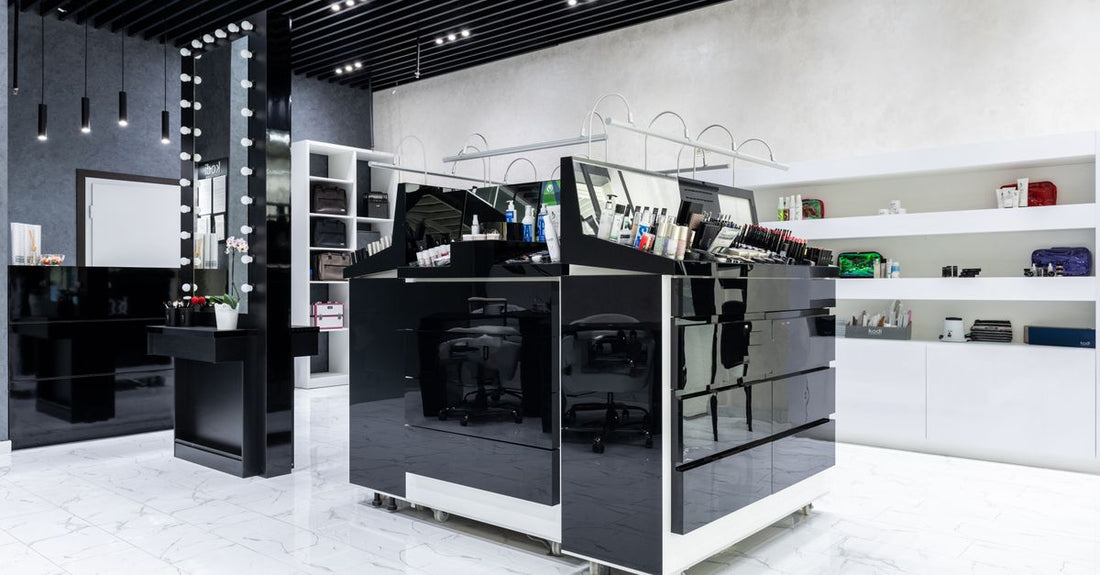 Clear acrylic cosmetic display cases neatly arranged on a white vanity, showing organised makeup and skincare products, best cosmetic display cases 2026