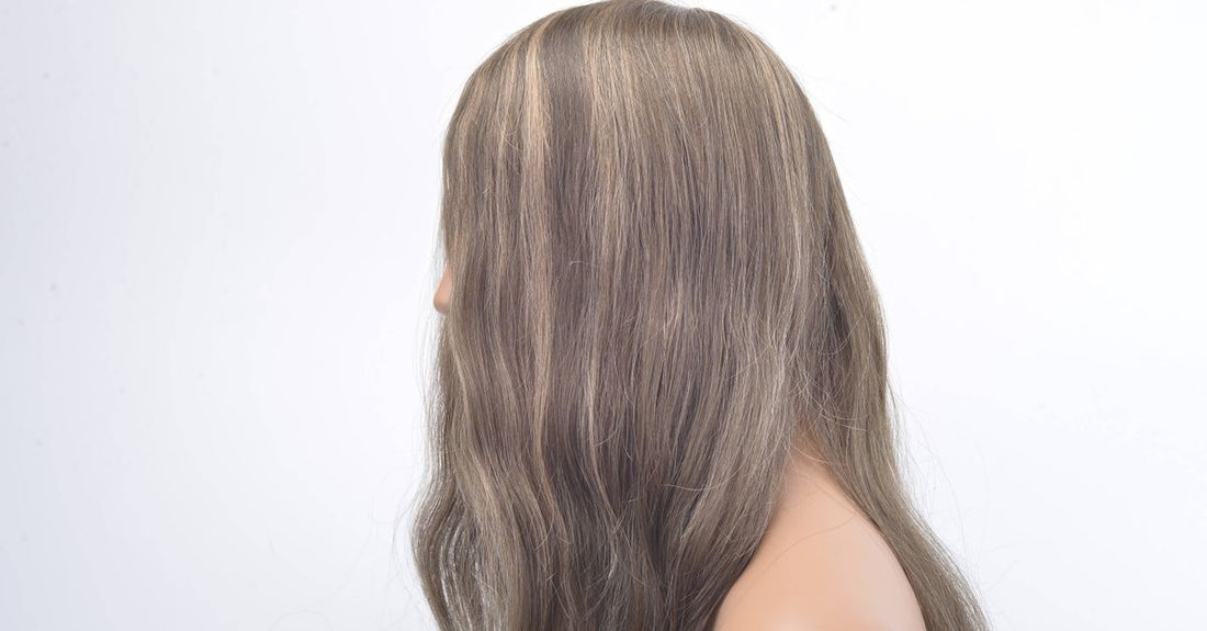 A selection of the best hairpieces 2026 displayed on a clean surface, including clip-in toppers and ponytail extensions.
