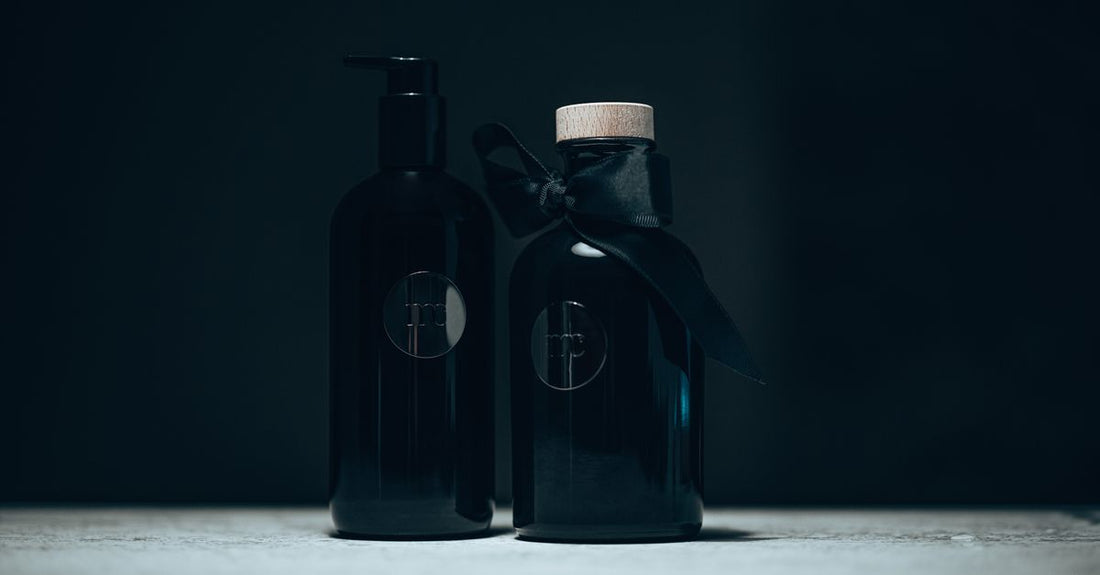A selection of personal lubricant bottles on a clean, neutral background, illustrating a lubricants buying guide UK.