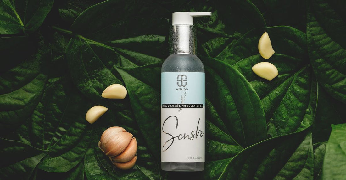 A selection of facial cleanser bottles in a clean flatlay arrangement, illustrating a cleansers buying guide.