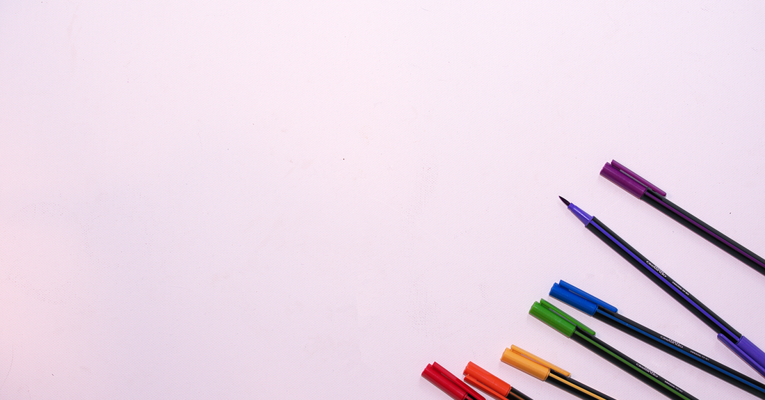 Assorted nail art pens with fine tips in a flat lay on a white background, showing where to buy nail art pens online.