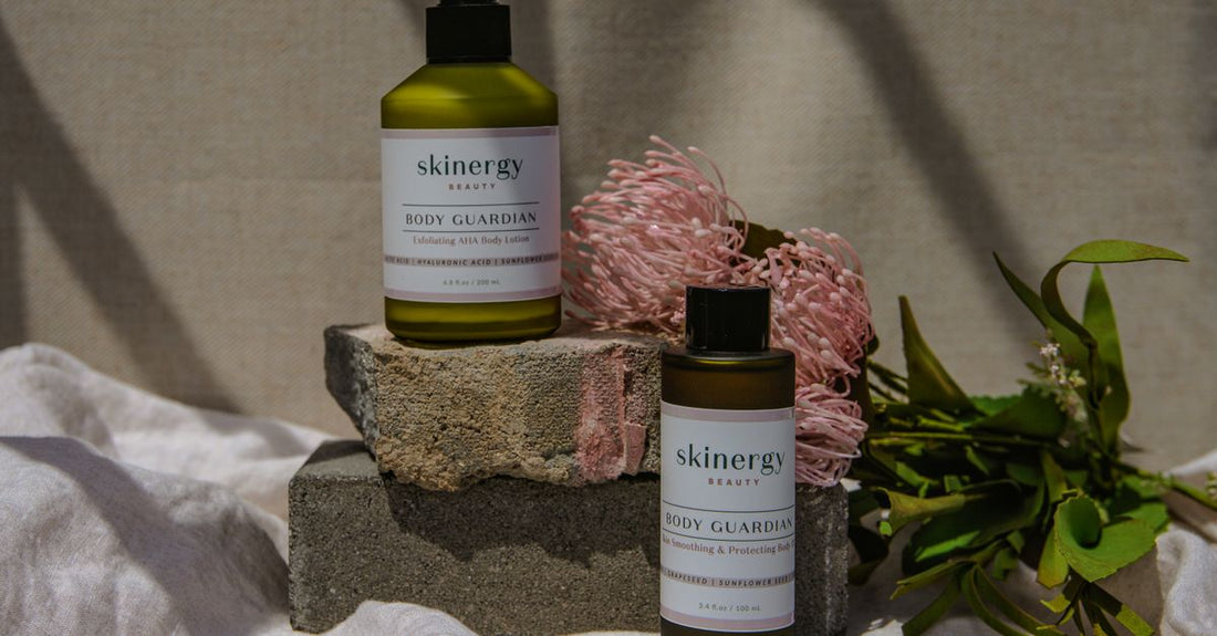 Assortment of body lotion bottles on a marble surface, illustrating how to choose lotions UK for different skin needs.