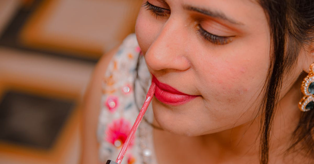 Collection of luxury lipstick tubes on a marble surface, illustrating a lipstick buying guide for flawless colour selection.