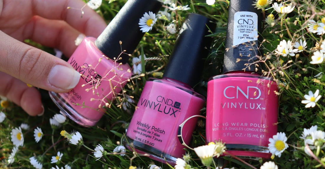 A flatlay of colourful nail polish bottles, representing a nail polish buying guide UK for building a flawless routine.