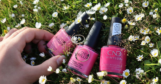 Five nail polish bottles arranged on a white background, showcasing the best nail polish 2026 shades in a clean flatlay.