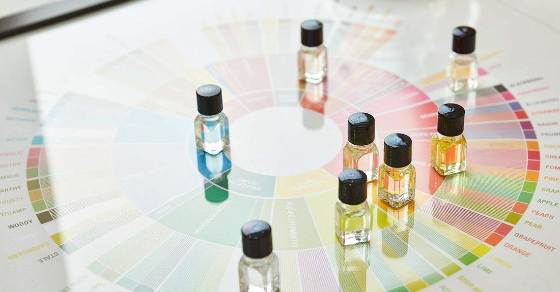 An array of designer cologne bottles on a marble shelf, showcasing a cologne buying guide in action.