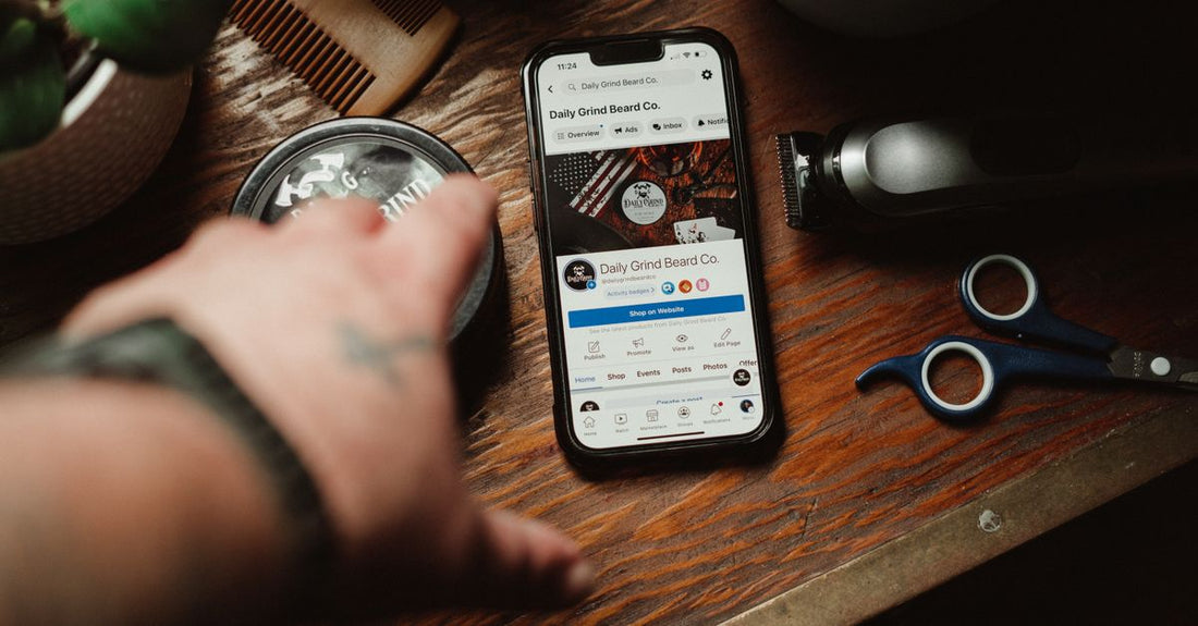 A high-end electric beard trimmer lying on a clean, minimalist surface with grooming accessories, illustrating how to trim beard with trimmer professionally.