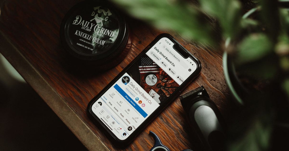 A selection of men's beard and mustache trimmers laid out on a dark surface, showing different blade types and attachments for how to choose beard & mustache trimmers.