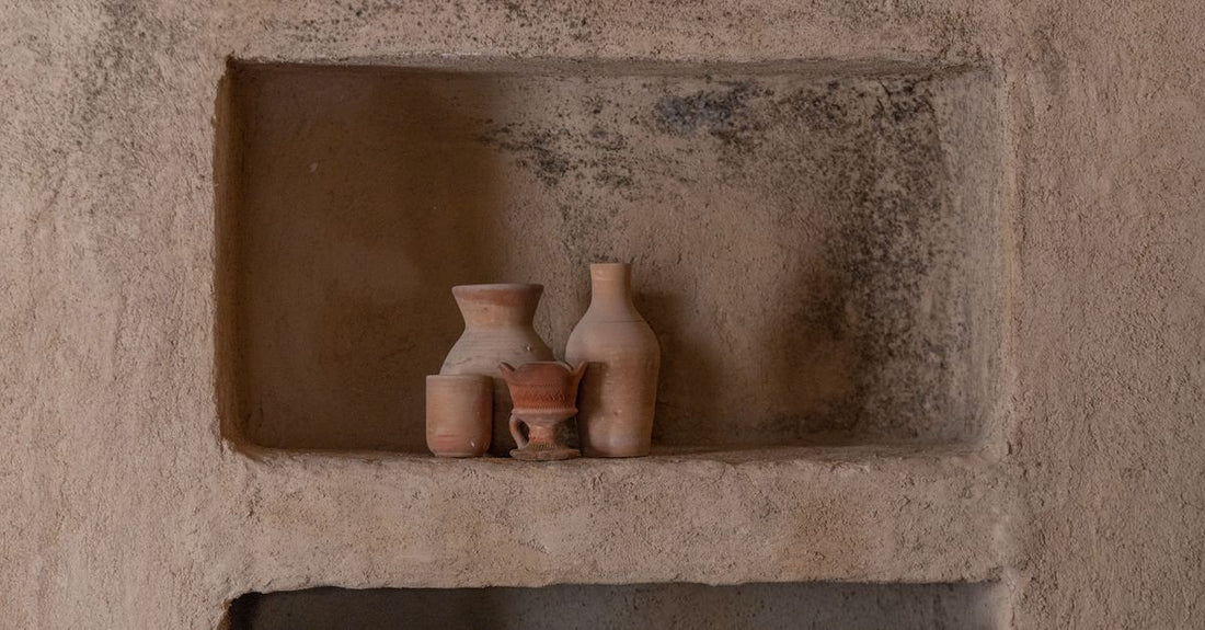 Three jars of styling and skincare clay on a shelf, representing how to choose clays UK for different uses