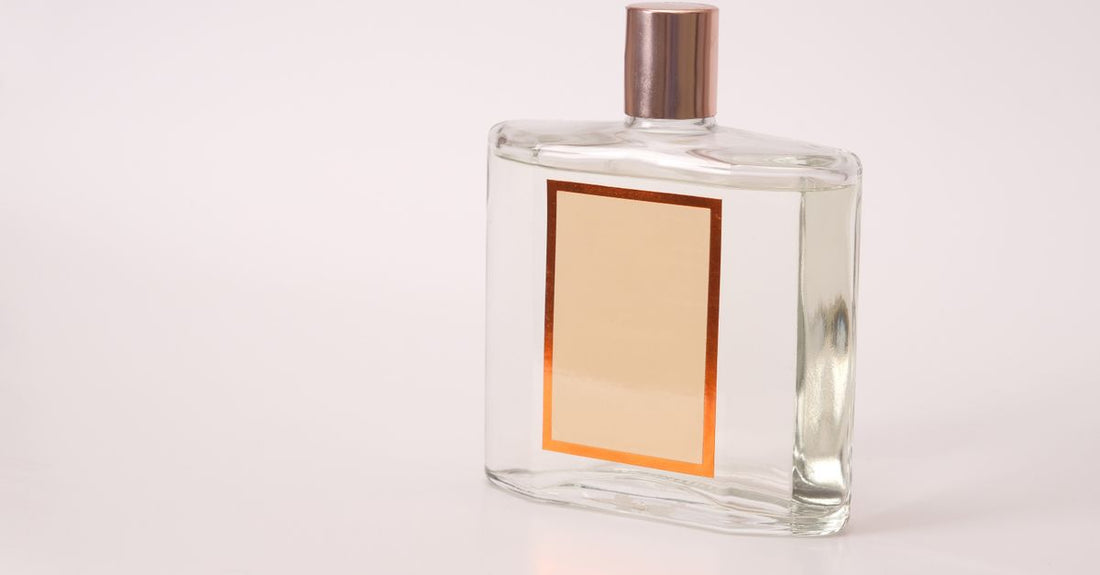 A display of various men's cologne bottles on a shelf, illustrating how to choose cologne UK.