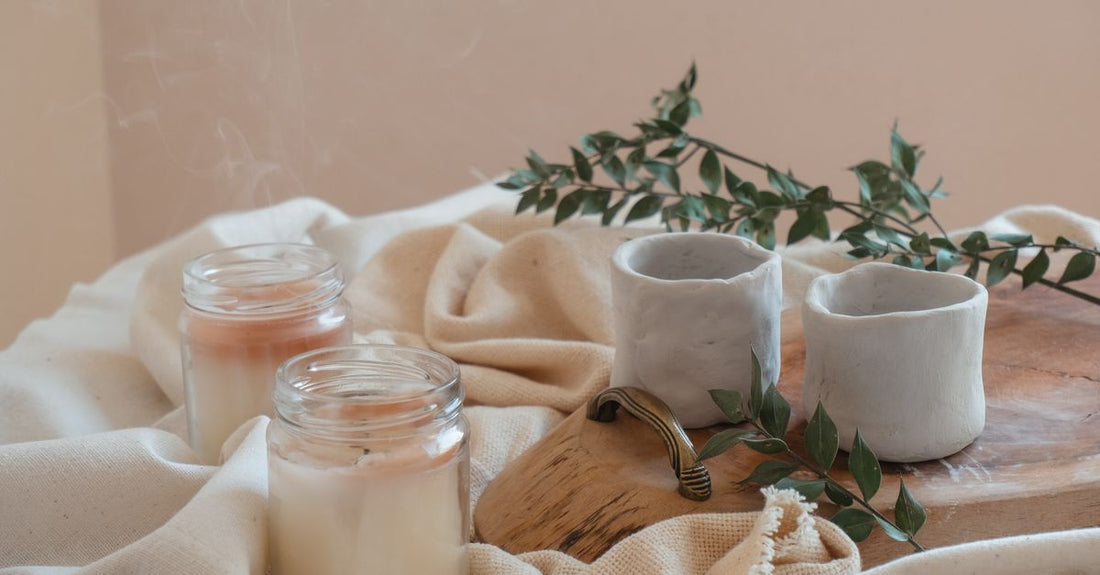 A white ceramic jar of rich moisturising balm on a marble surface, illustrating the balms & moisturisers buying guide for UK shoppers.