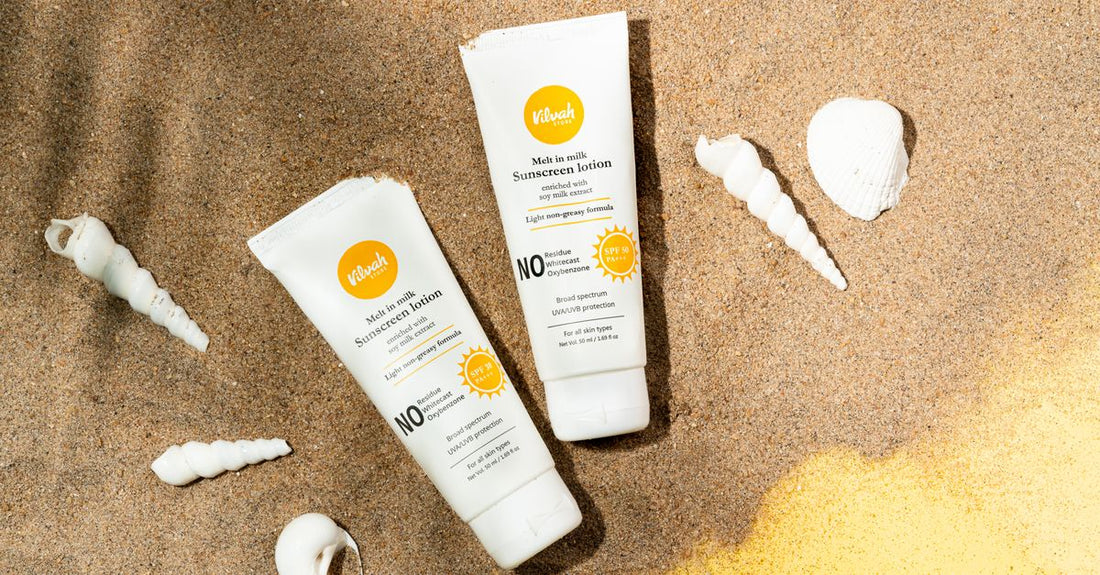 Best sunscreen for face under makeup UK displayed in a clean flatlay with skincare products
