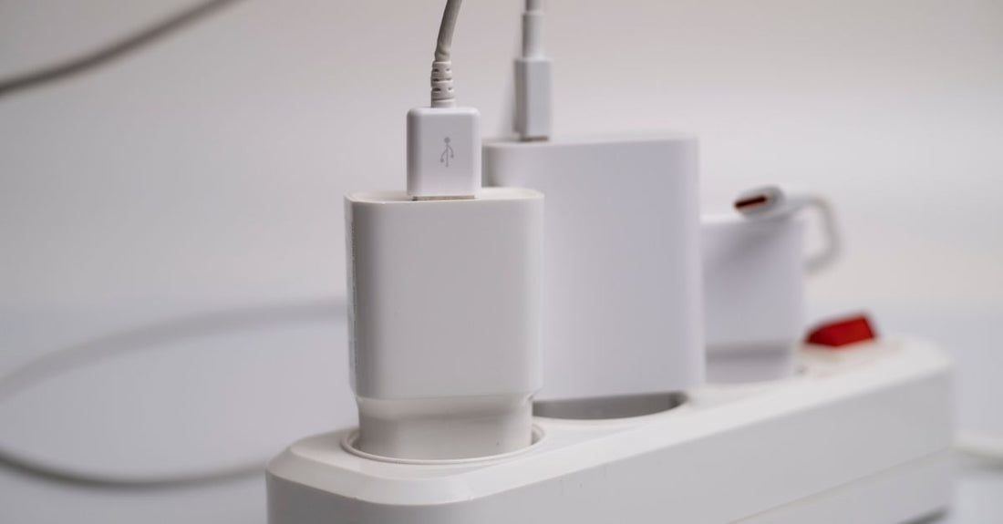 A selection of beauty tool accessories and replacement charger cables for electric shavers and trimmers, arranged neatly on a white surface.