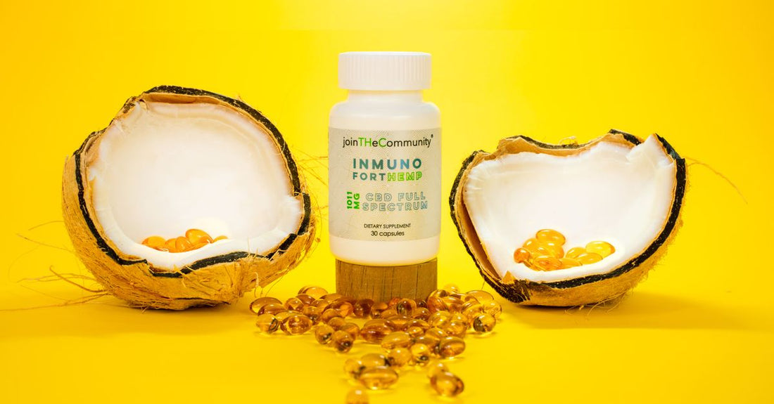 A glass jar of organic virgin coconut oil with a wooden spoon on a light background, illustrating a coconut buying guide