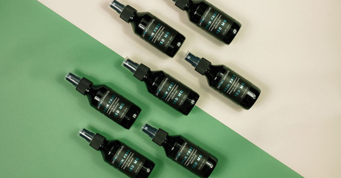 Assortment of hair spray bottles in a flatlay, illustrating a hair sprays buying guide UK.