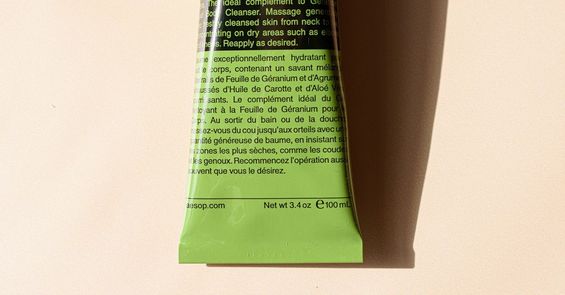 A selection of neck and décolleté skincare products arranged on a marble surface, illustrating how to choose neck & décolleté UK treatments.