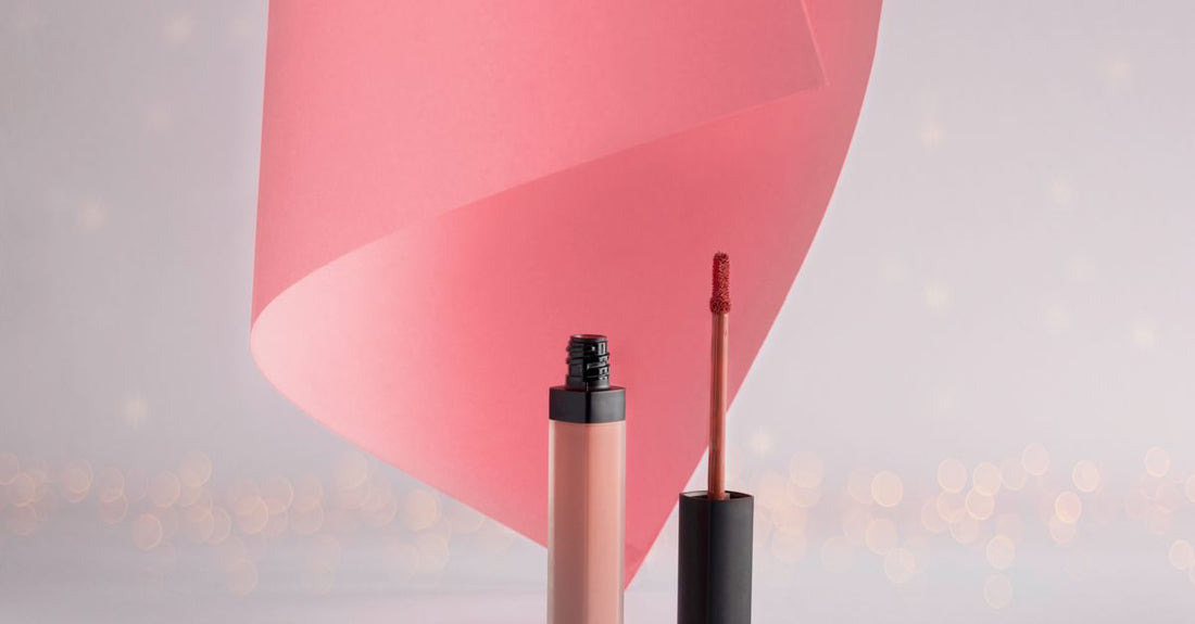 A clear lip gloss tube on a white background, demonstrating how to use lip gloss without sticky texture.