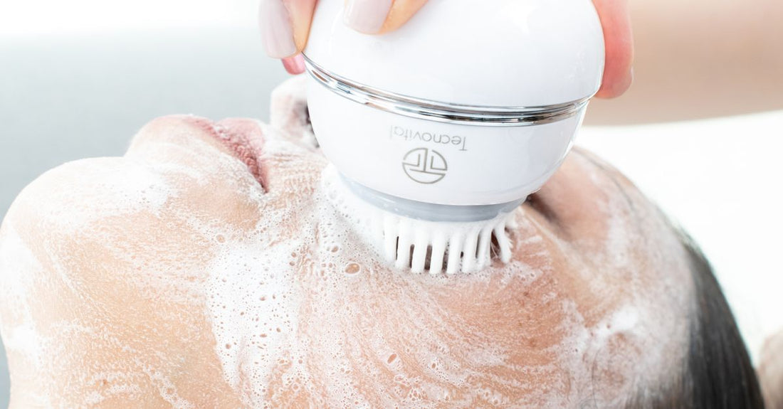 A selection of blackhead and blemish remover tools arranged on a clean surface, including stainless steel extractors and a pore vacuum.