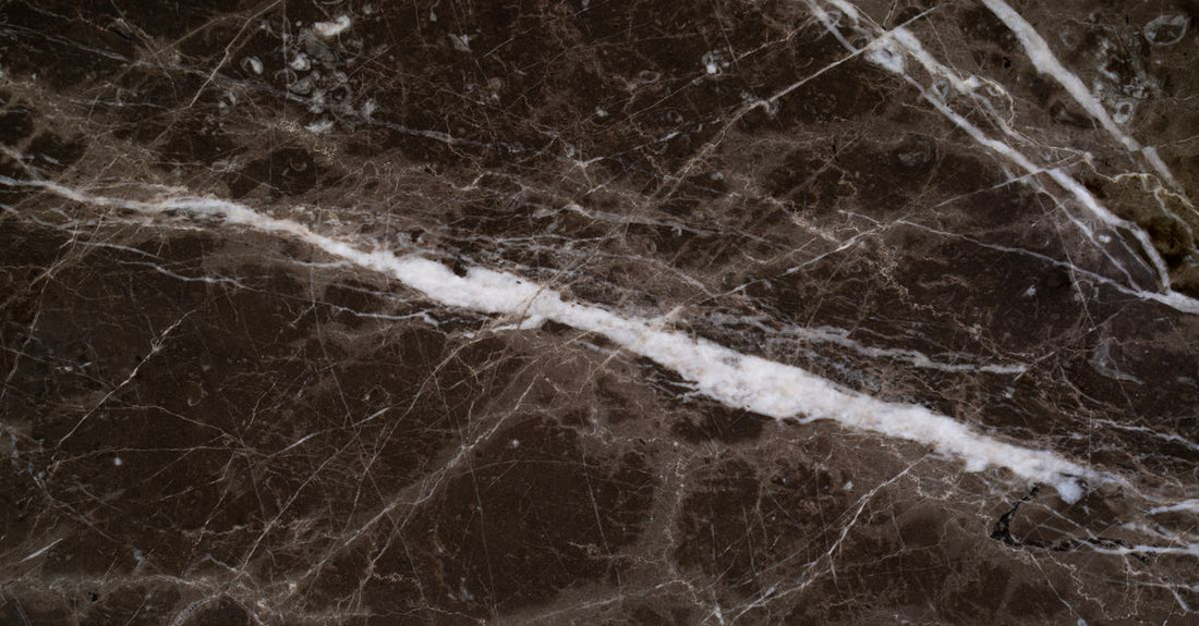 A collection of best eau de parfum 2026 bottles on a white marble surface, representing data-driven scent selection.