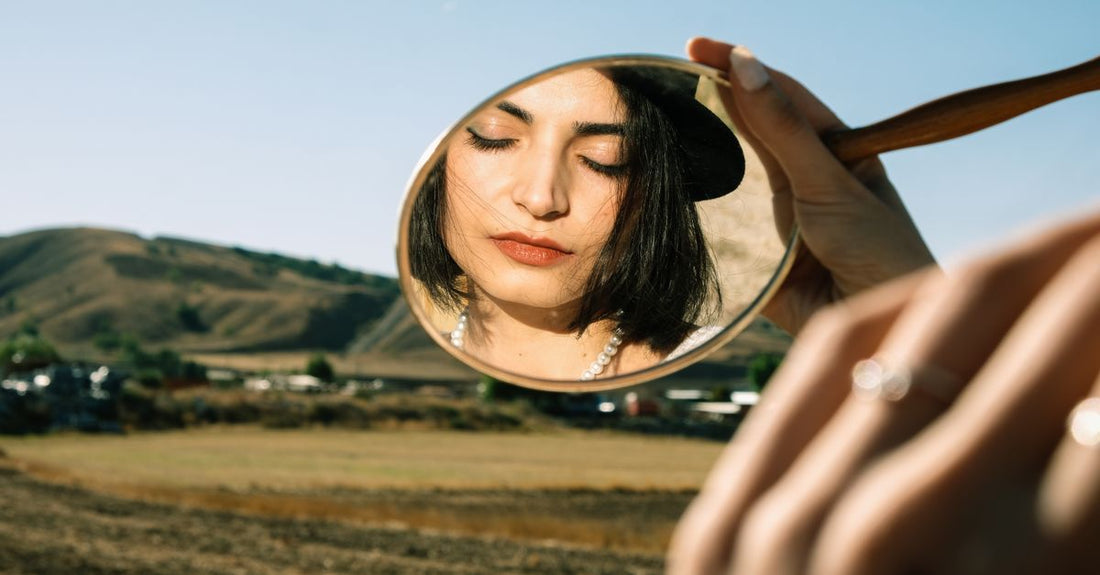 A selection of handheld mirrors with different magnifications on a white background, illustrating a handheld mirrors buying guide.