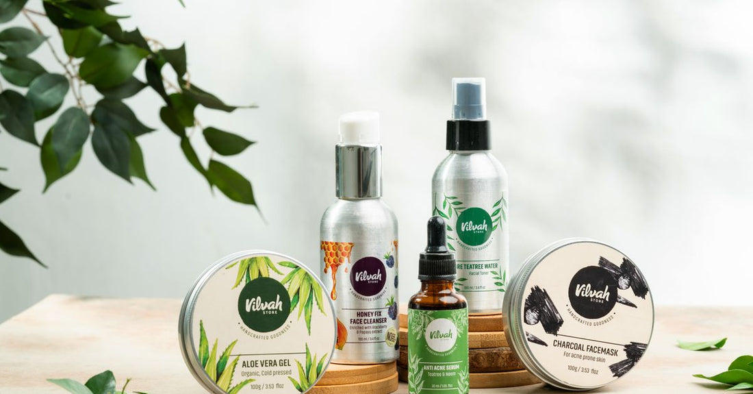 A flatlay of essential men's skincare products including a cleanser, moisturiser, and SPF on a clean surface to illustrate how to build a skincare routine for men.