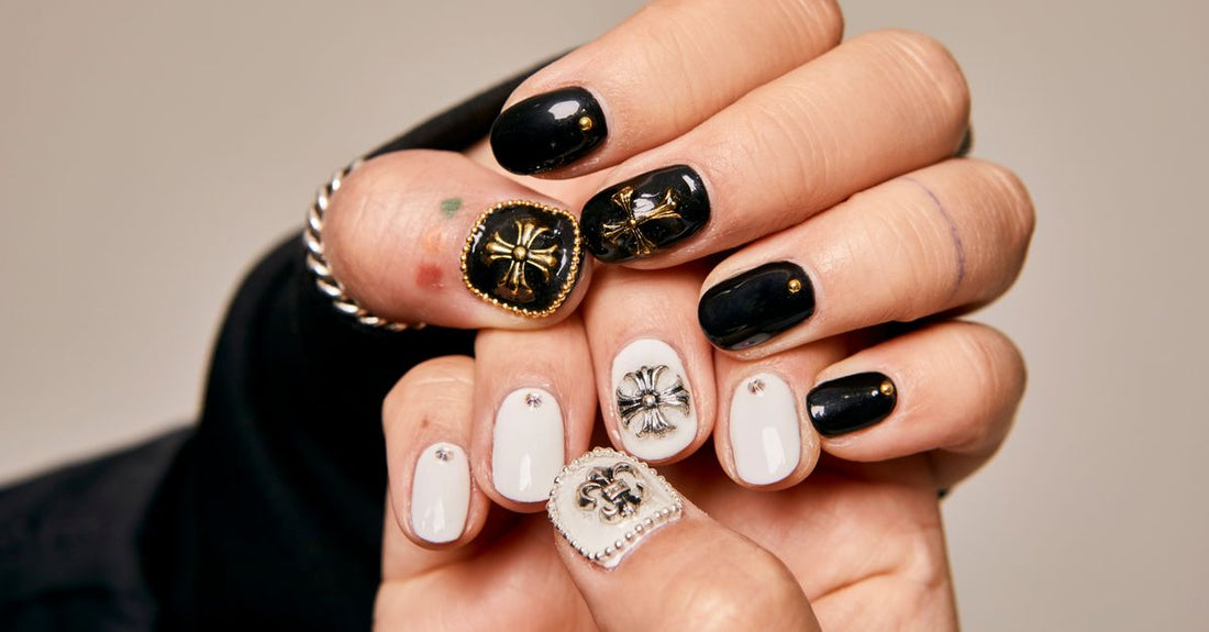 Flat lay of colourful 3D nail art charms, gems, and decoration kits on a white background, showcasing variety for a decoration kits buying guide.